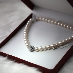 Gold jewelry on a soft neutral surface
